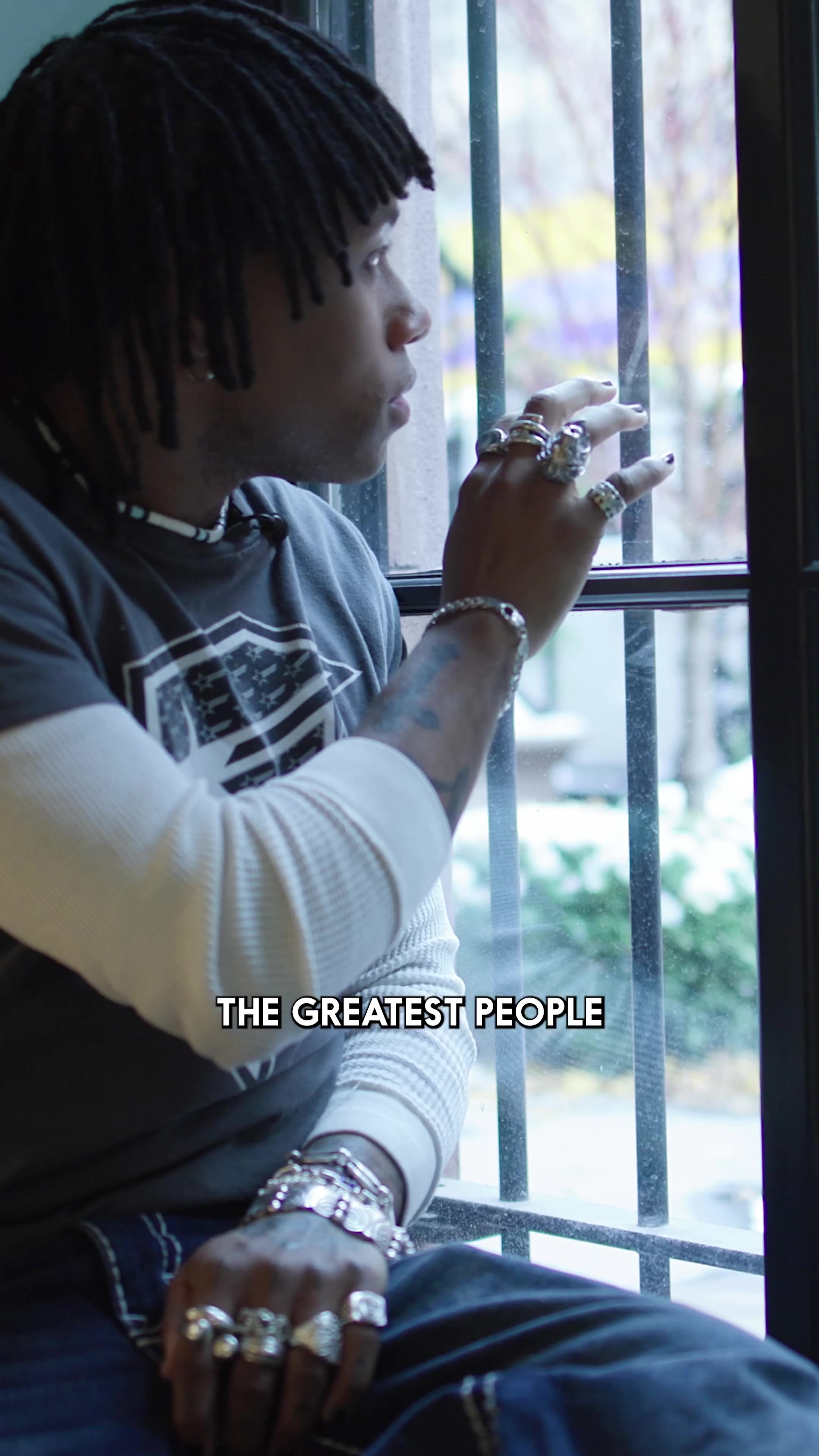 Selling Skylines — Jordan looking out a barred window, captioned 