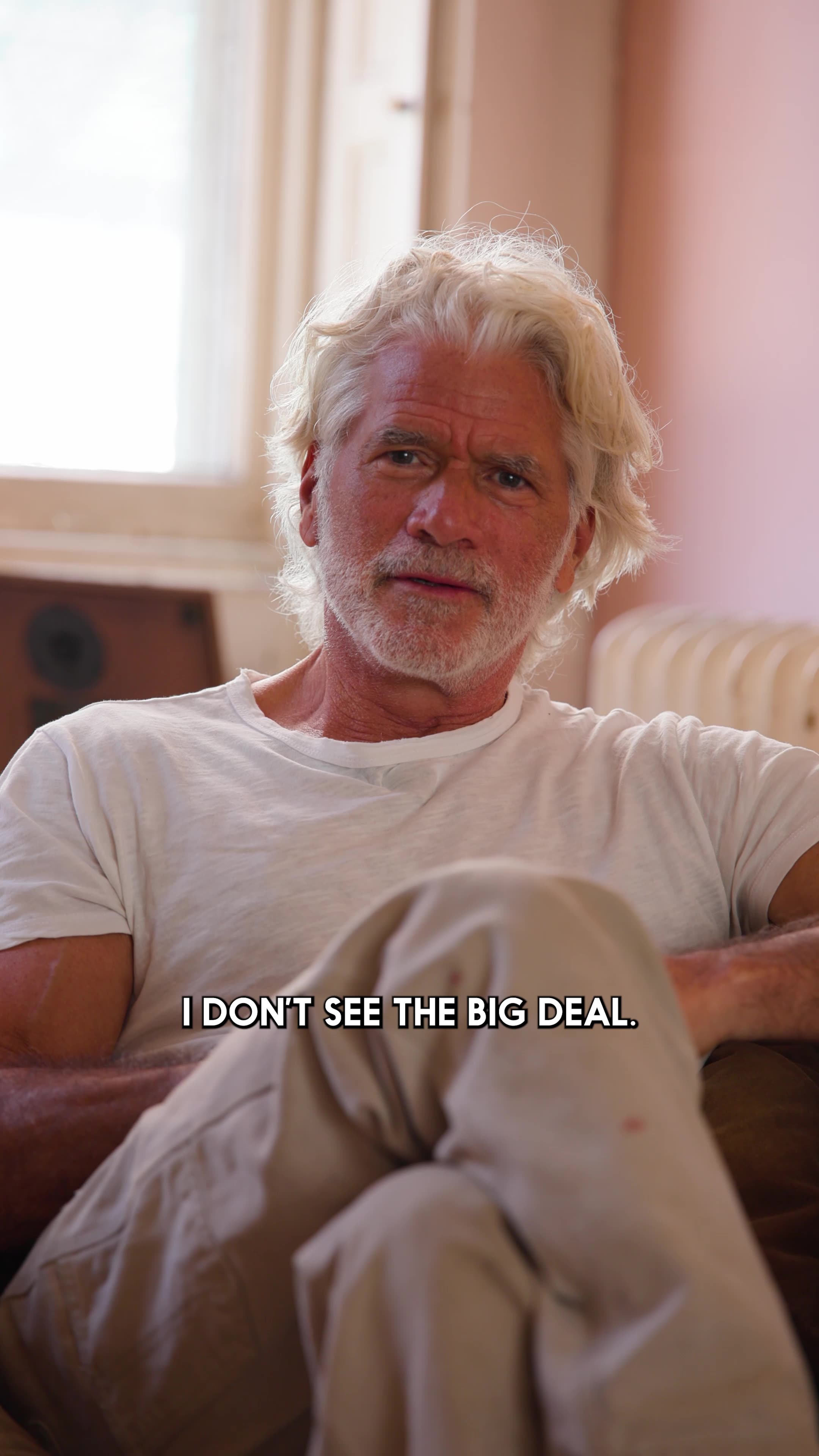 Selling Skylines — an older man on a couch, captioned 