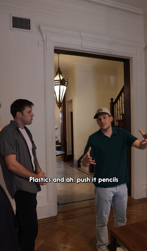 Selling Skylines — two men chatting in a hallway