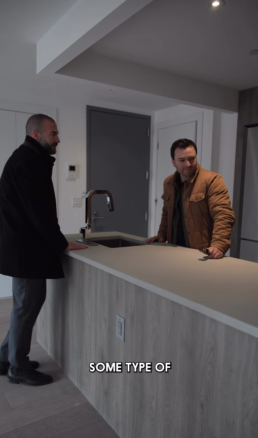 Selling Skylines — Jordan and a client discussing a kitchen counter